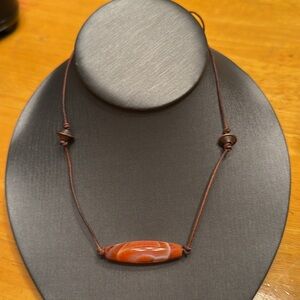 Handcrafted 18 inch cord necklace.